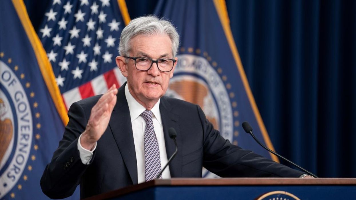U.S. Federal Reserve Chair Jerome Powell stands at a podium.