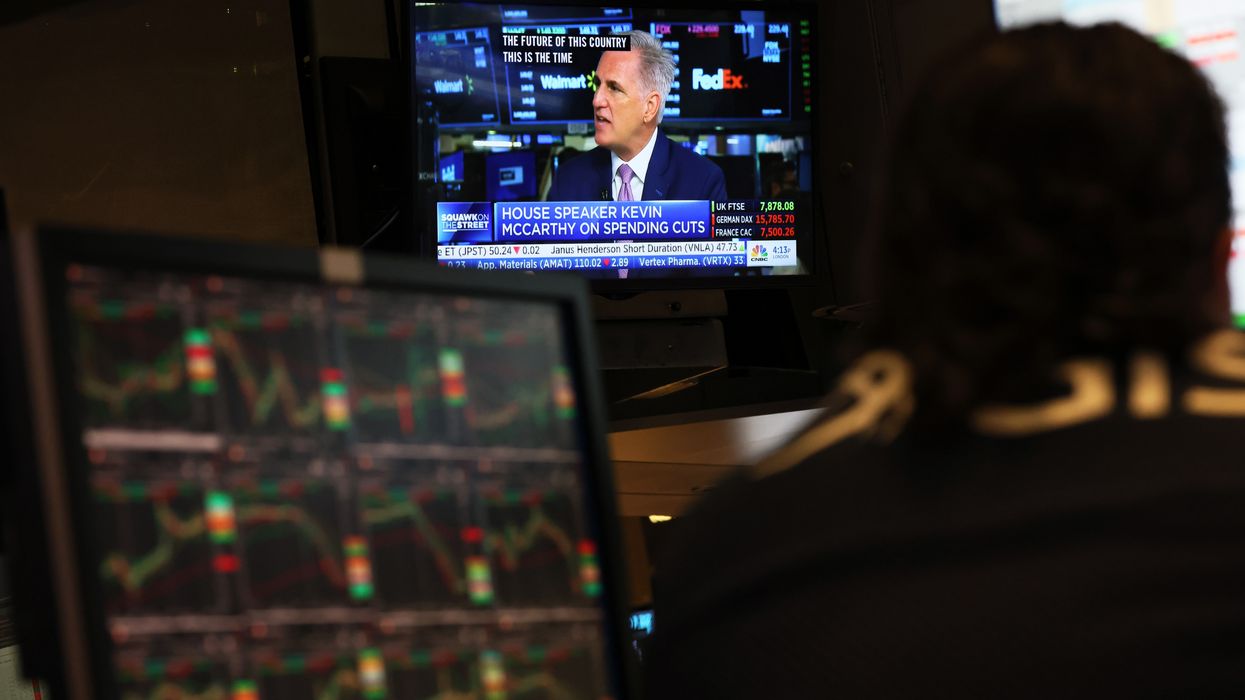U.S. House Speaker Kevin McCarthy is seen on a television screen giving an interview