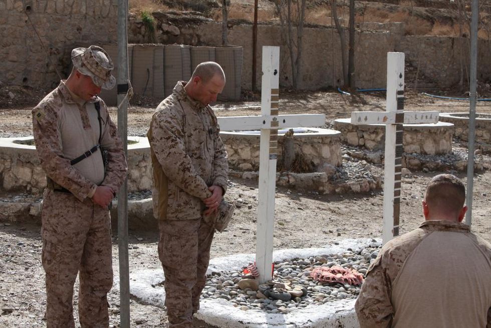 U.S. Marines mourn the deaths of U.S. troops in Kajai, Afghanistan.