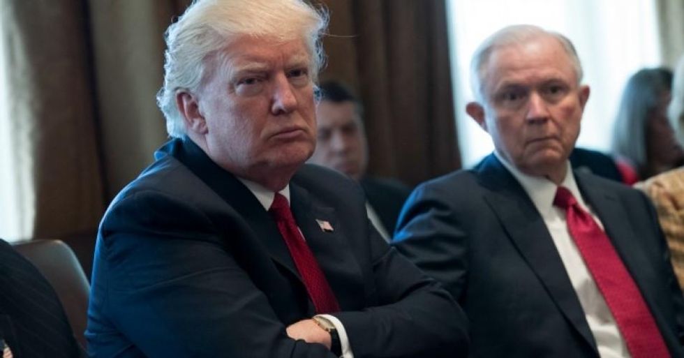 U.S. President Donald Trump and Attorney General Jeff Sessions attend a panel discussion in the Roosevelt Room of the White House March 29, 2017 in Washington, DC. (Photo: Shawn Thew-Pool/Getty Images)