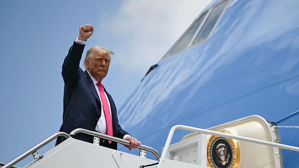 U.S. President Donald Trump boards Air Force One