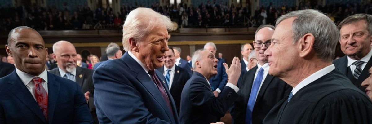 U.S. President Donald Trump greets Supreme Court Chief Justice John Roberts