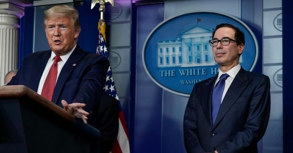 U.S. President Donald Trump, joined by Secretary of the Treasury Steven Mnuchin, speaks during a briefing on the coronavirus pandemic, in the press briefing room of the White House on March 25, 2020 in Washington, DC. (Photo: Drew Angerer/Getty Images)