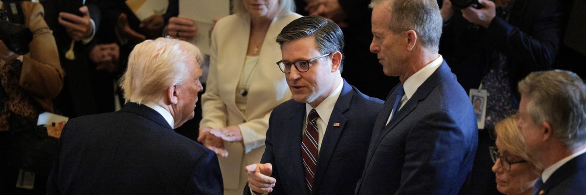 U.S. President Donald Trump shakes hands with House Speaker Rep. Mike Johnson