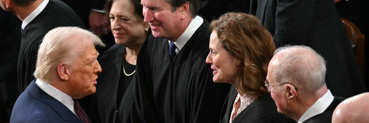 U.S. President Donald Trump shakes hands with Supreme Court Associate Justice Amy Coney Barrett