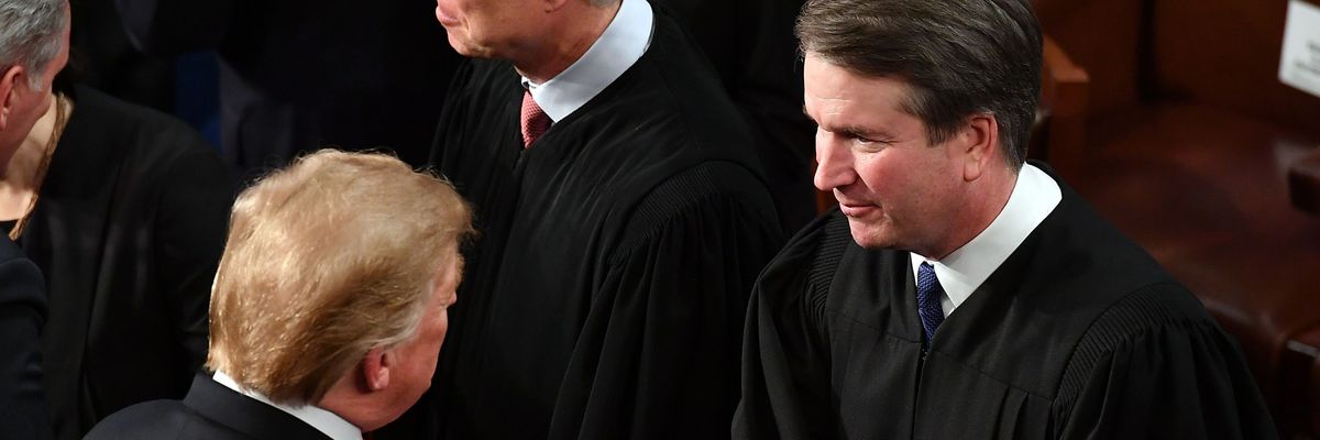U.S. President Donald Trump shakes hands with Supreme Court Justice Brett Kavanaugh