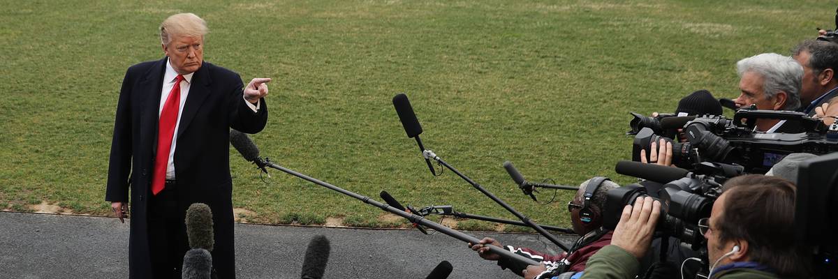 U.S. President Donald Trump talks to reporters