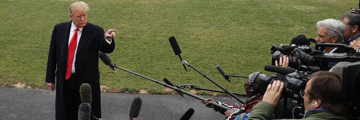 U.S. President Donald Trump talks to reporters