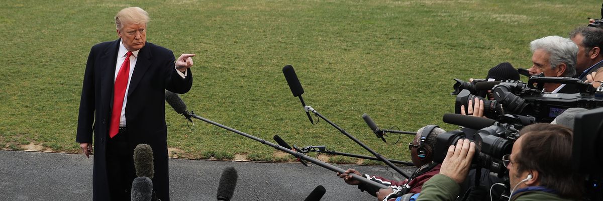 U.S. President Donald Trump talks to reporters