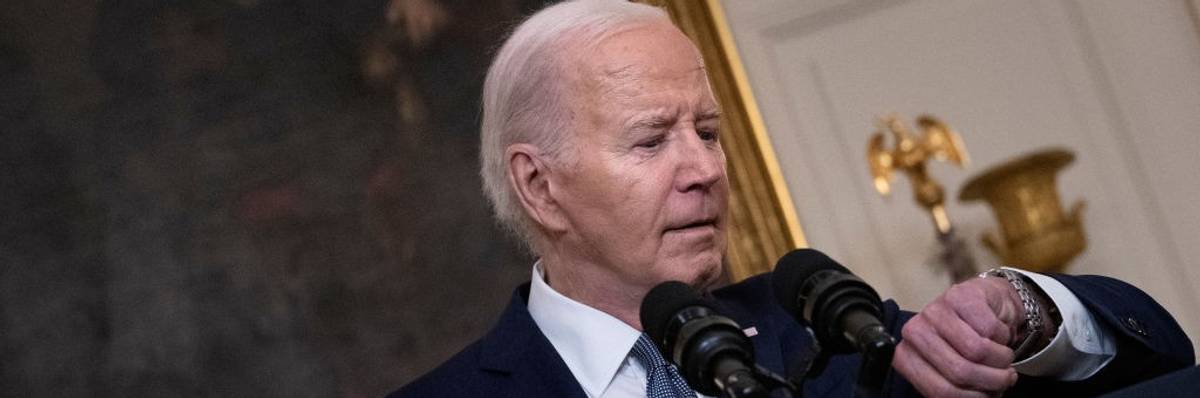 U.S. President Joe Biden checks his watch