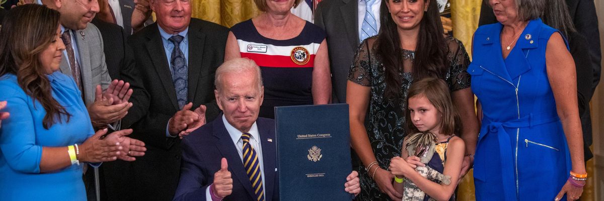 U.S. President Joe Biden gestures during a signing ceremony for the PACT Act of 2022, in the East Room of the White House in Washington, DC, on August 10, 2022
