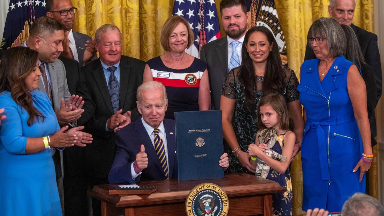 U.S. President Joe Biden gestures during a signing ceremony for the PACT Act of 2022, in the East Room of the White House in Washington, DC, on August 10, 2022