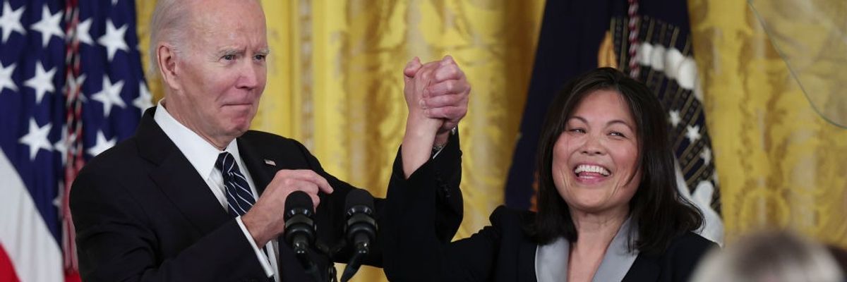 U.S. President Joe Biden holds hands with his then-nominee for U.S. secretary of labor, Julie Su