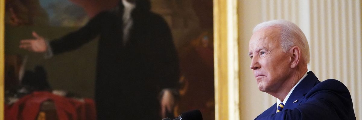 U.S. President Joe Biden listens to a question from a reporter during a press conference