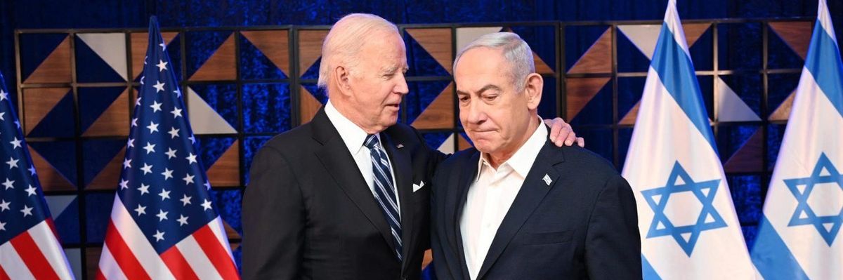 U.S. President Joe Biden puts his arm around Israeli Prime Minister Benjamin Netanyahu's shoulder