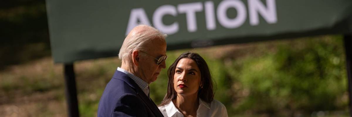 U.S. President Joe Biden speak with Rep. Alexandria Ocasio-Cortez (D-N.Y.)