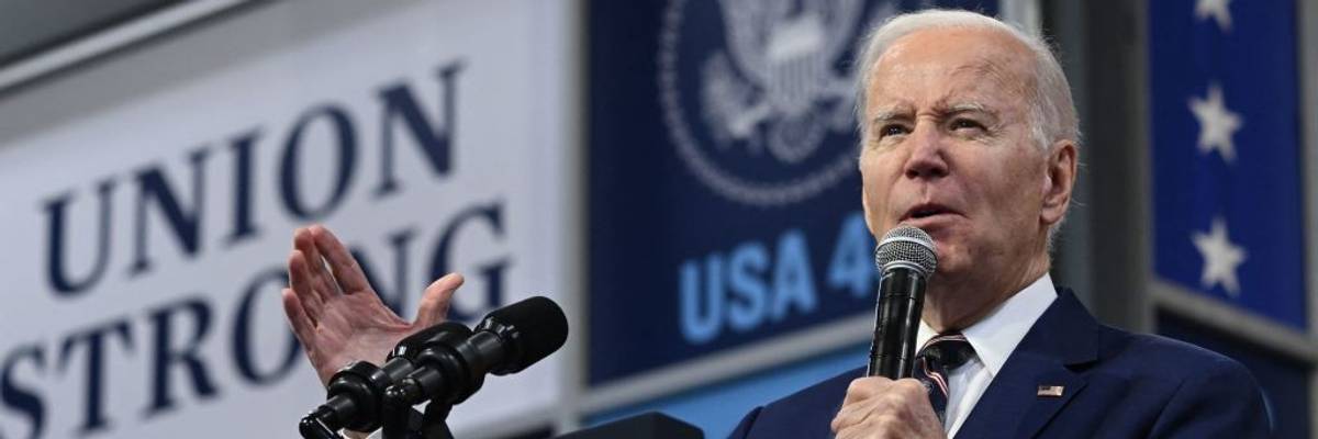 U.S. President Joe Biden speaks at a podium.