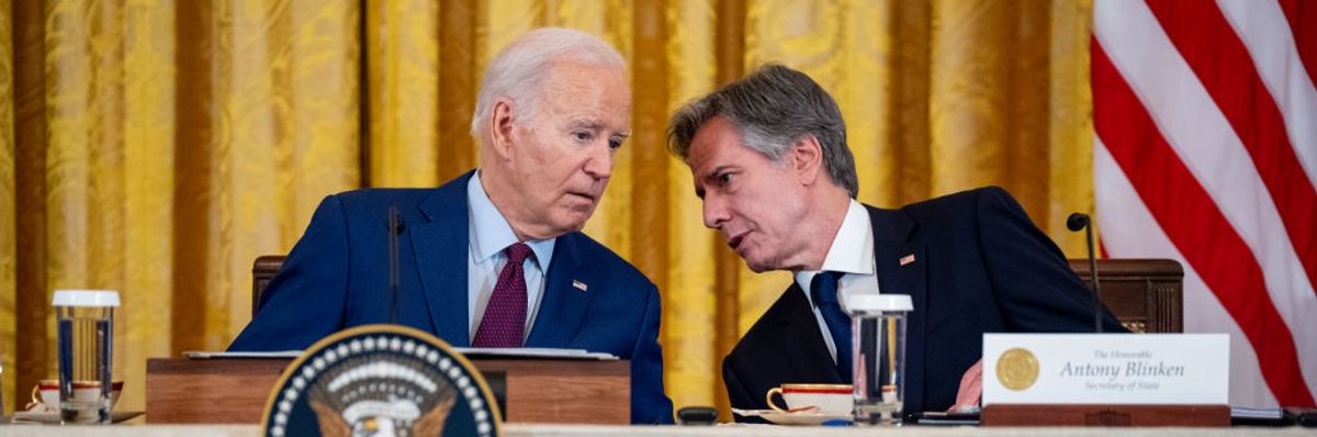 U.S. President Joe Biden speaks with Secretary of State Antony Blinken