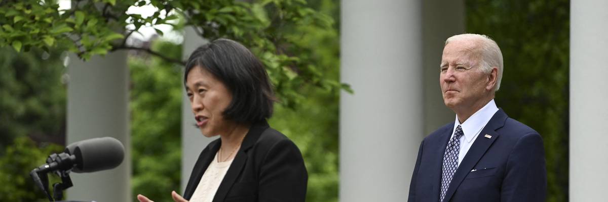 U.S. President Joe Biden watches as U.S. Trade Representative Katherine Tai speaks outside the White House on May 17, 2022.