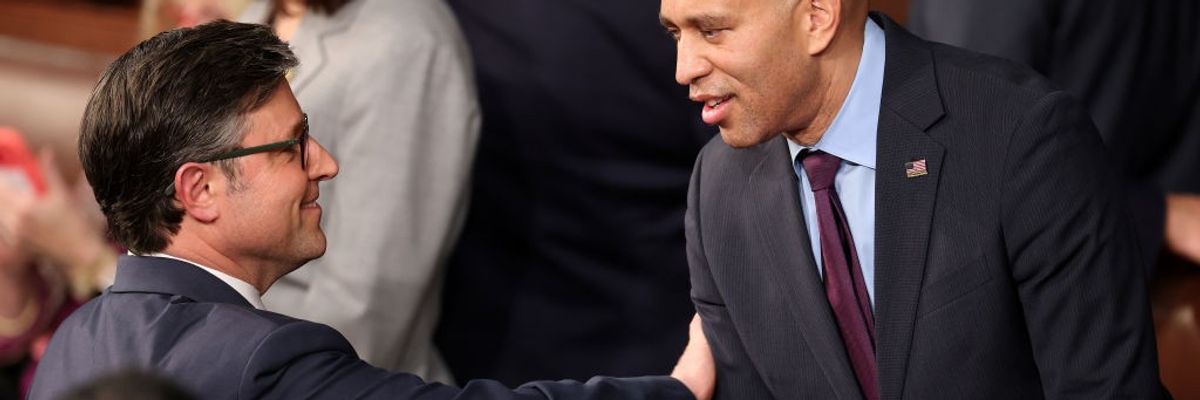 U.S. Rep. Mike Johnson (R-La.) talks to Rep. Hakeem Jeffries (D-N.Y.)