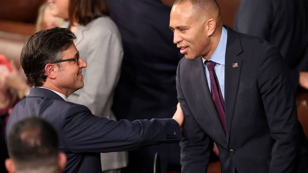 U.S. Rep. Mike Johnson (R-La.) talks to Rep. Hakeem Jeffries (D-N.Y.)