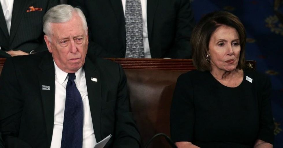 U.S. Rep Steny Hoyer (D-MD) and U.S. House Minority Leader Nancy Pelosi (D-CA) watch during the State of the Union address in the chamber of the U.S. House of Representatives January 30, 2018 in Washington, DC. This is the first State of the Union address given by U.S. President Donald Trump and his second joint-session address to Congress. (Photo: Alex Wong/Getty Images)