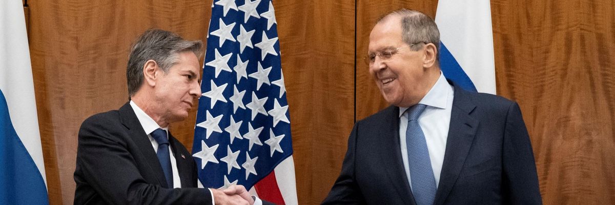 U.S. Secretary of State Antony Blinken and Russian Foreign Minister Sergey Lavrov shake hands.