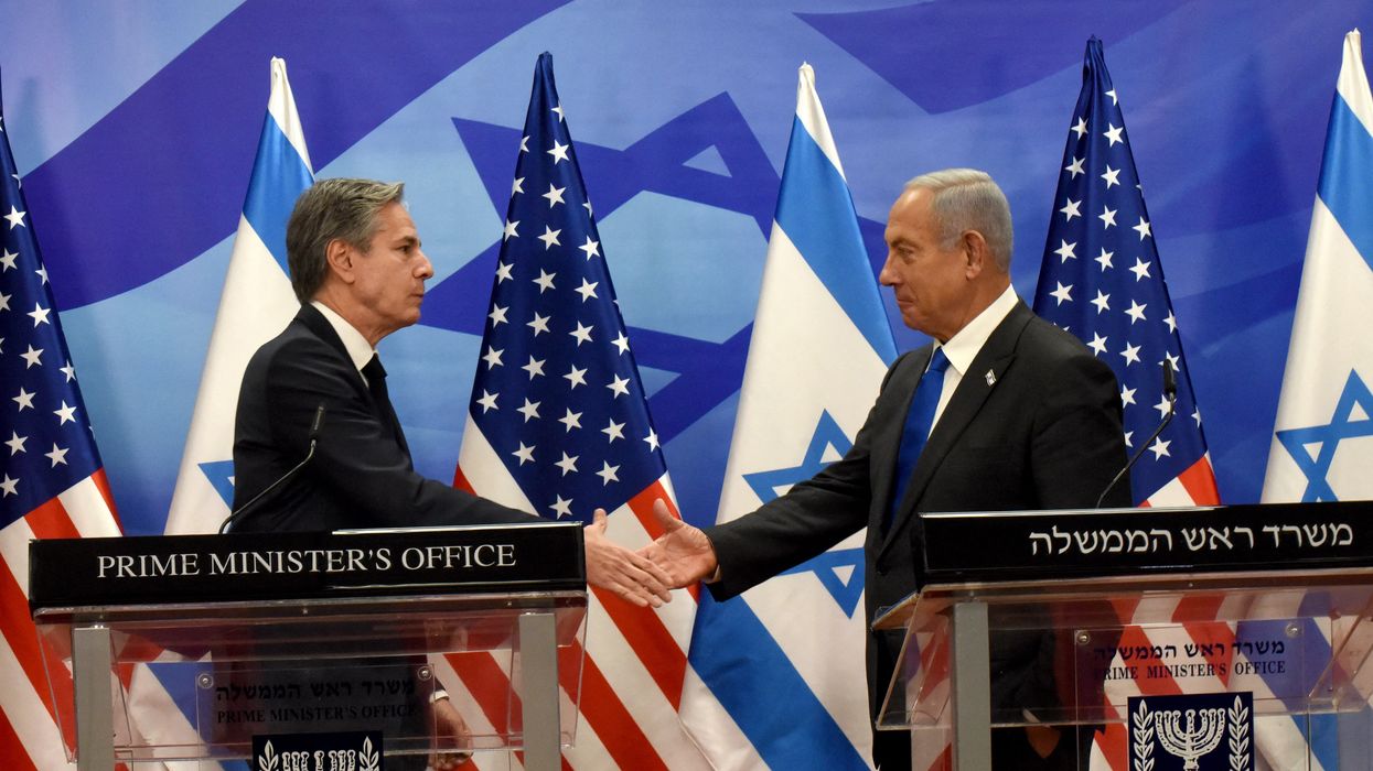 U.S. Secretary of State Antony Blinken shakes hands with Israeli Prime Minister Benjamin Netanyahu