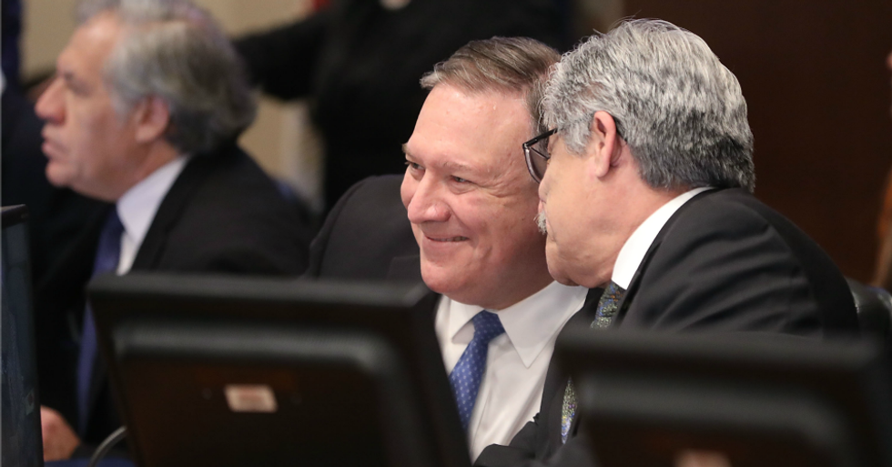 U.S. Secretary of State Mike Pompeo talks with Carlos Alberto Calles Castillo, Chair of the Permanent Council, during a meeting of the Council of the Organization of American States (OAS), on January 24, 2019 in Washington, D.C. (Photo: Mark Wilson/Getty Images)