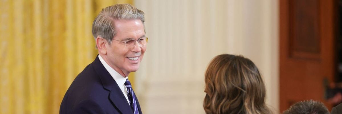 U.S. Secretary of the Treasury Scott Bessent speaks with U.S. Secretary of Homeland Security Kristi Noem