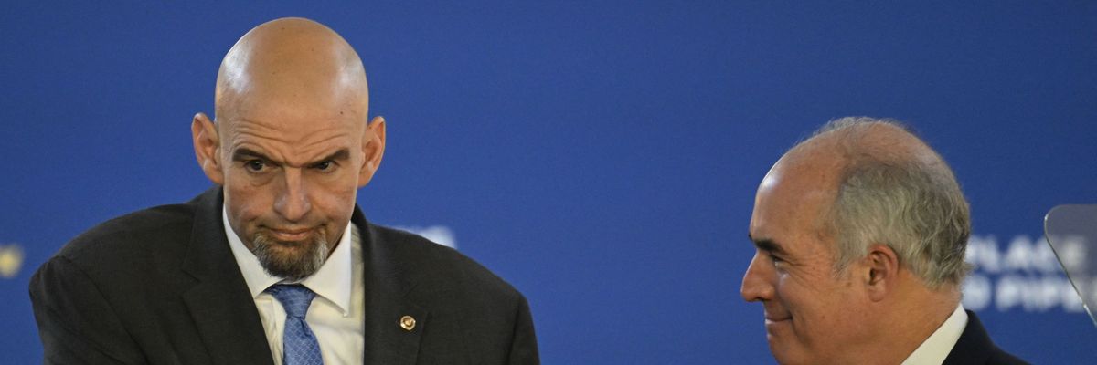 U.S. Sen. John Fetterman shakes hands with fellow Pennsylvania Democrat Sen. Bob Casey at Belmont Water Treatment Center in Philadelphia on February 3, 2023. 