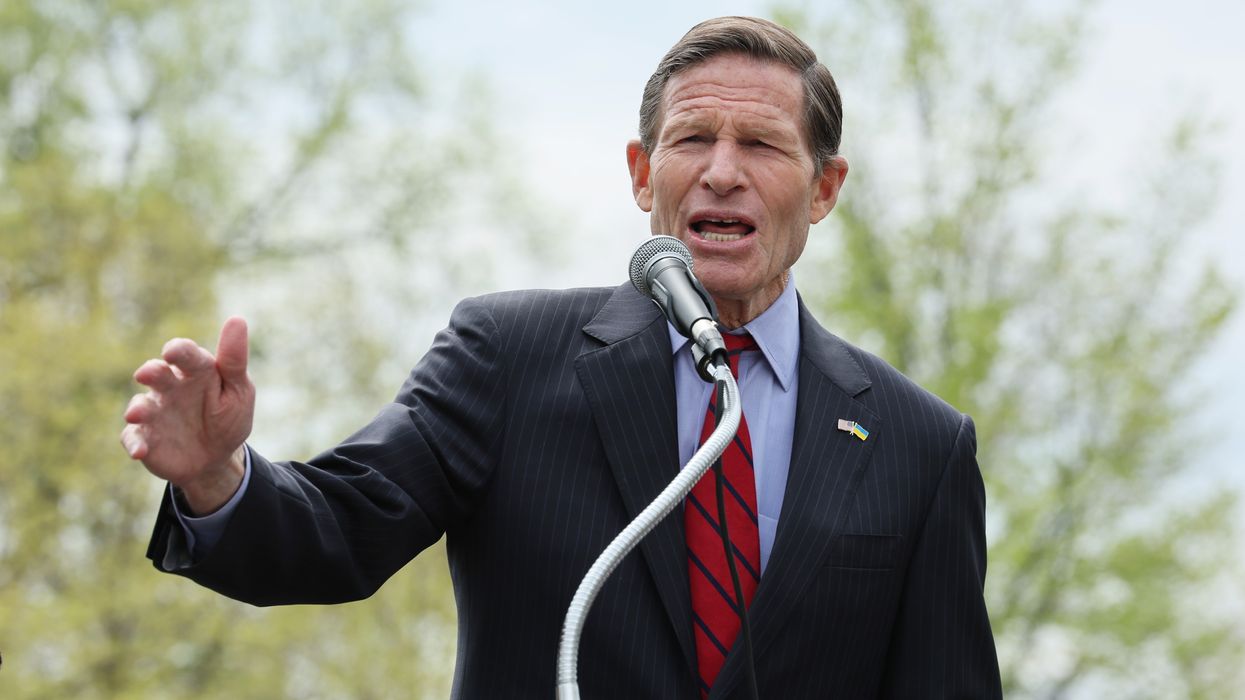U.S. Senator Richard Blumenthal stands at a podium wearing a suit.