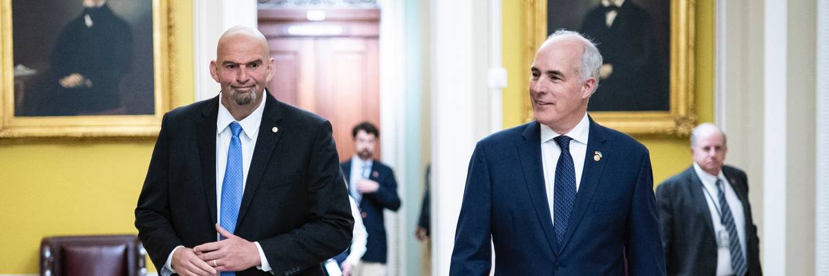 U.S. Sens. John Fetterman and Bob Casey walk in the Capitol