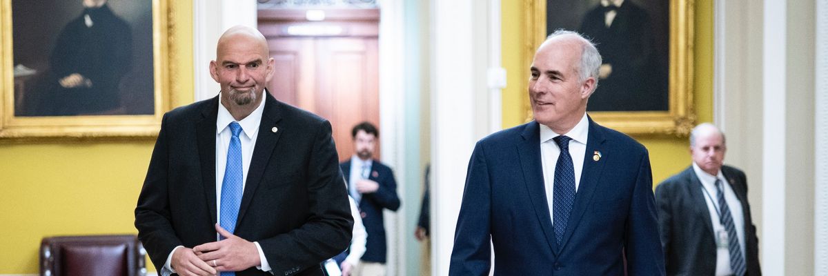 U.S. Sens. John Fetterman and Bob Casey walk in the Capitol