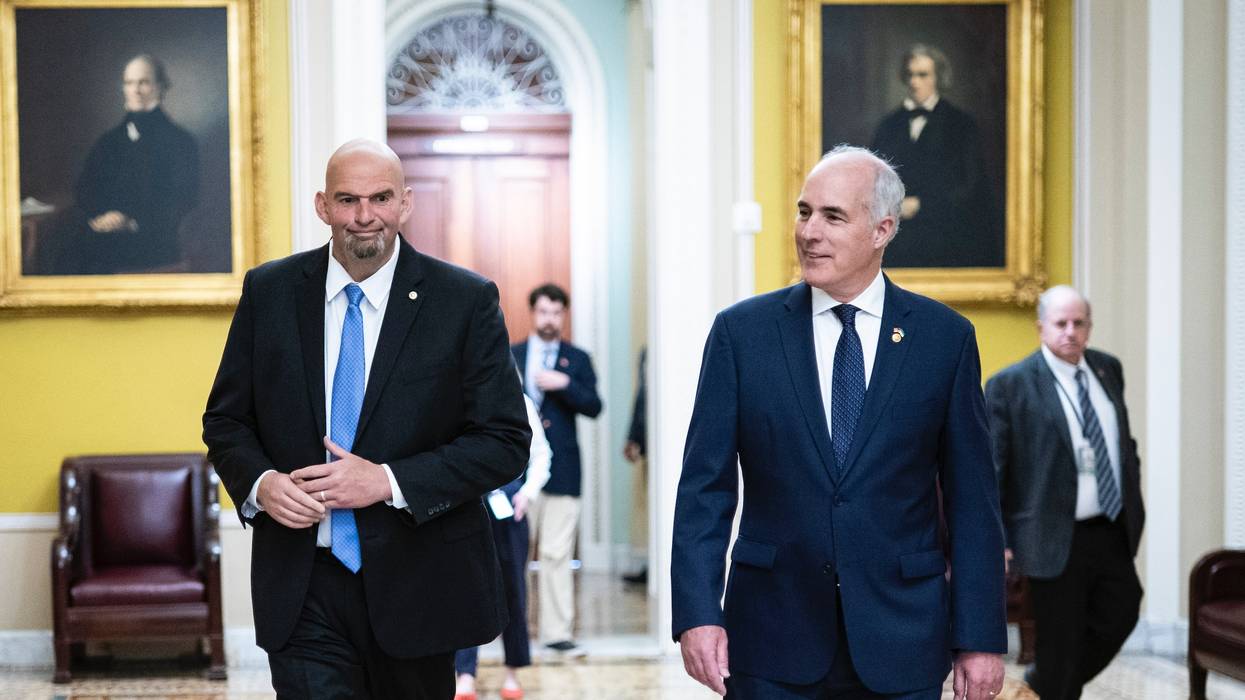 U.S. Sens. John Fetterman and Bob Casey walk in the Capitol
