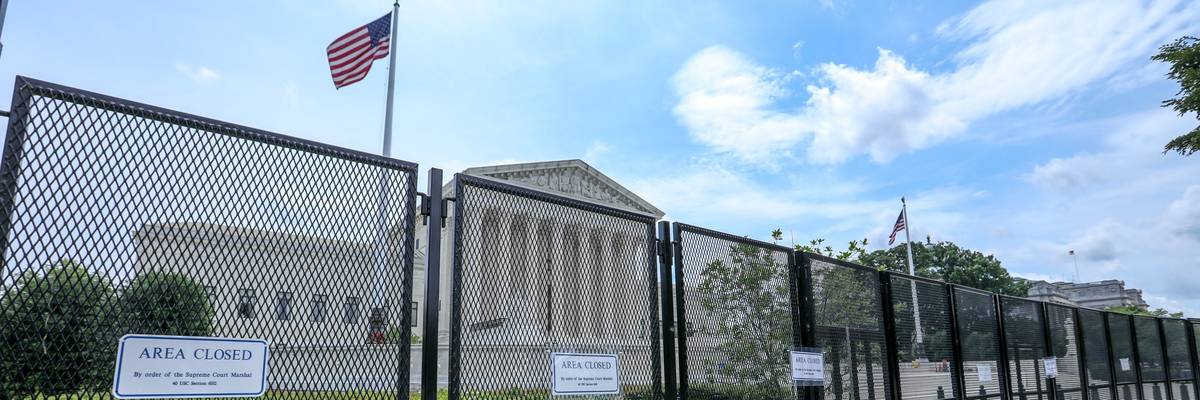 U.S. Supreme Court behind fencing.