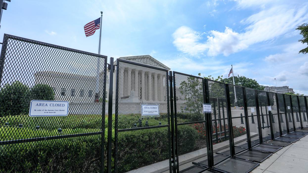 U.S. Supreme Court behind fencing.