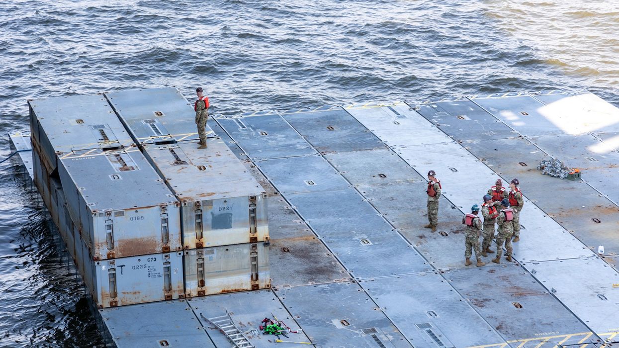 U.S. troops prepare components of the Gaza aid pier