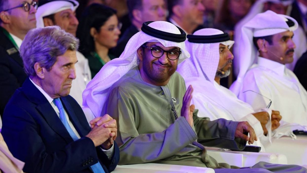 UAE Minister of State and CEO of the Abu Dhabi National Oil Company (ADNOC), Sultan Ahmed al-Jaber (C) and US Presidential Envoy for Climate John Kerry
