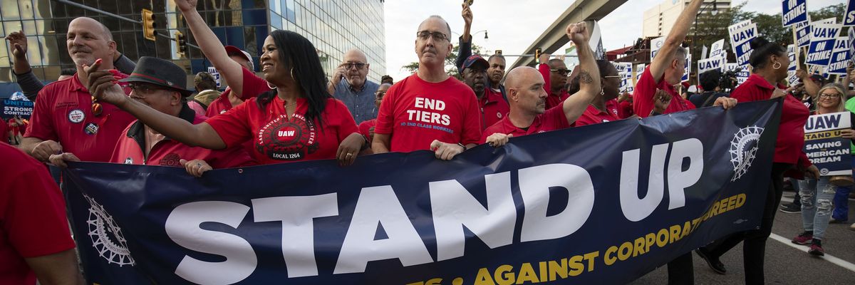 UAW president Shawn Fain marches