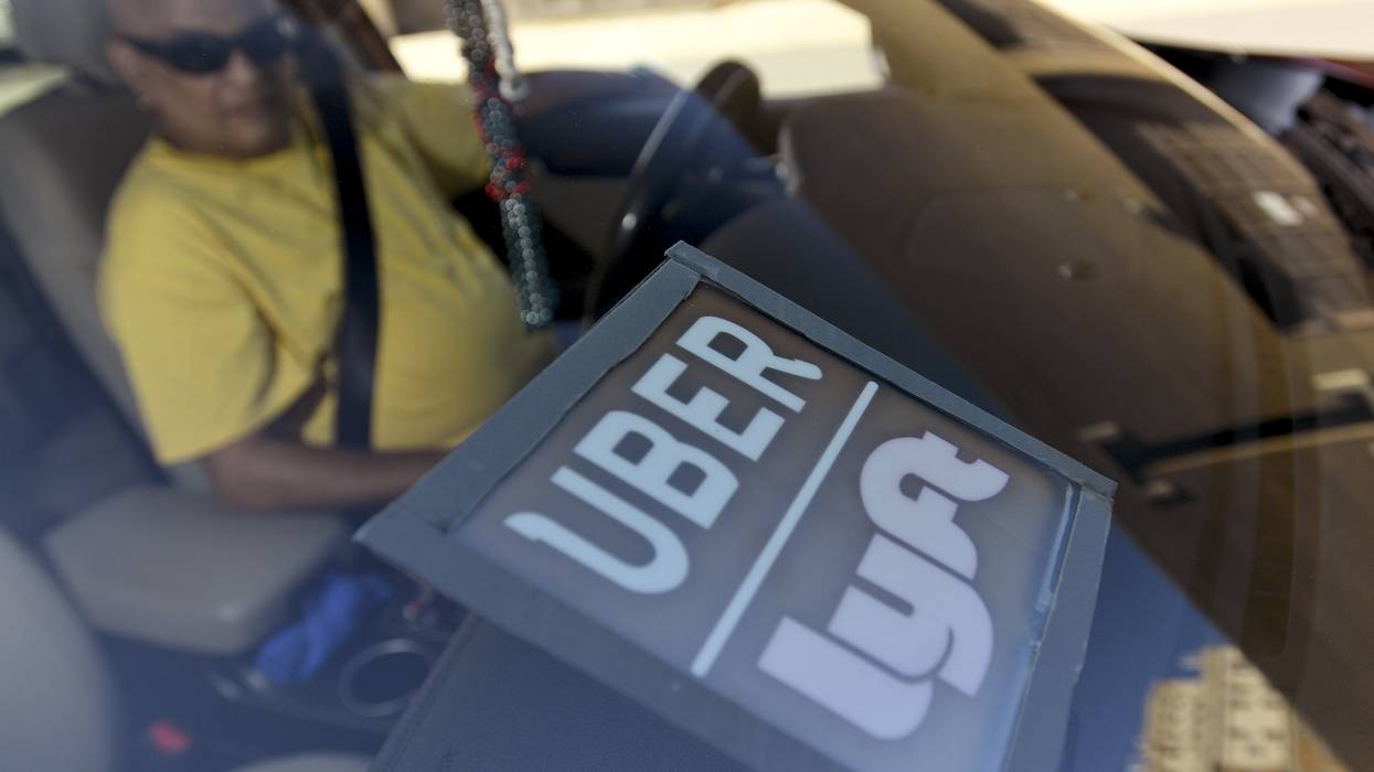 Uber and Lyft driver in car.