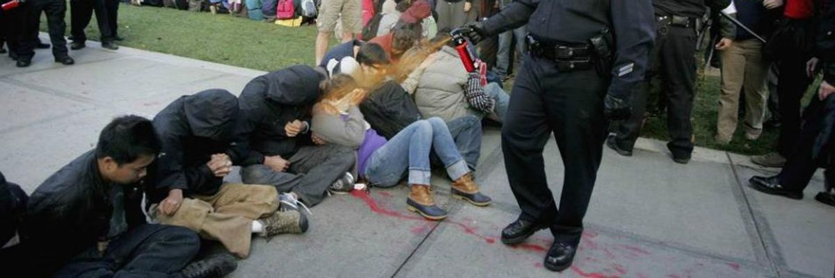 UC Davis police Lieutenant John Pike pepper-sprays students during their sit-in at an "Occupy UCD" demonstration in Davis, Calif. on Nov. 18, 2011