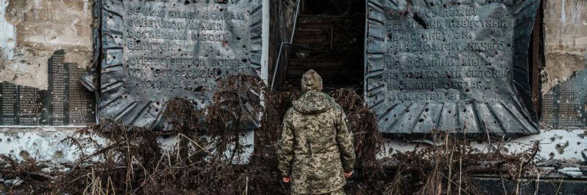 Ukraine soldier at WWI memorial in Done