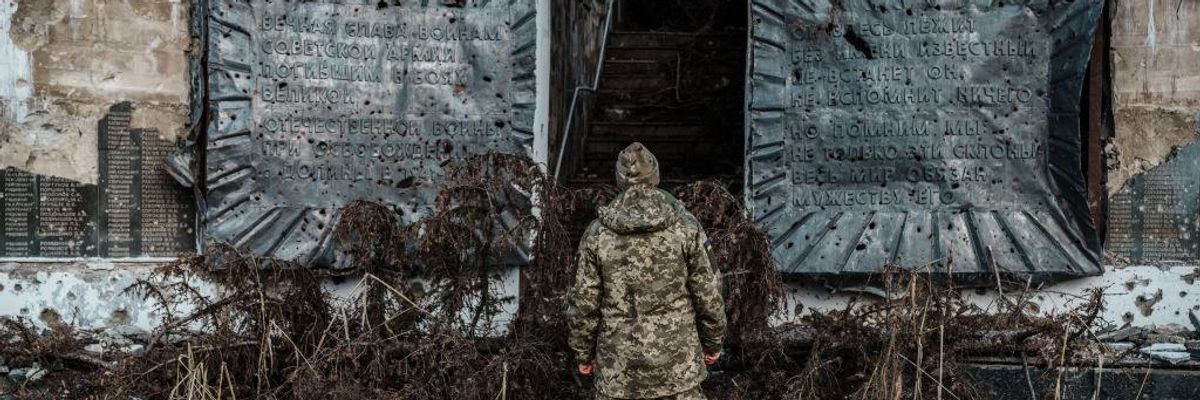 Ukraine soldier at WWI memorial in Done