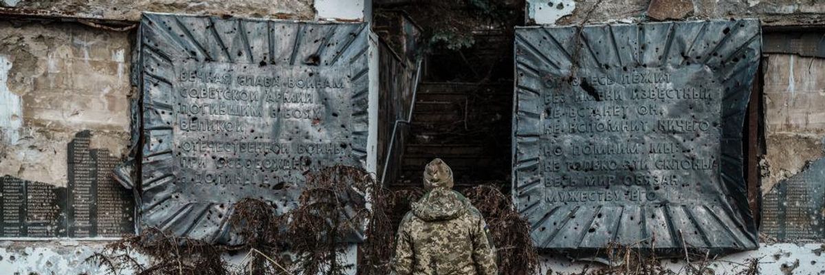 Ukraine soldier at WWI memorial in Done
