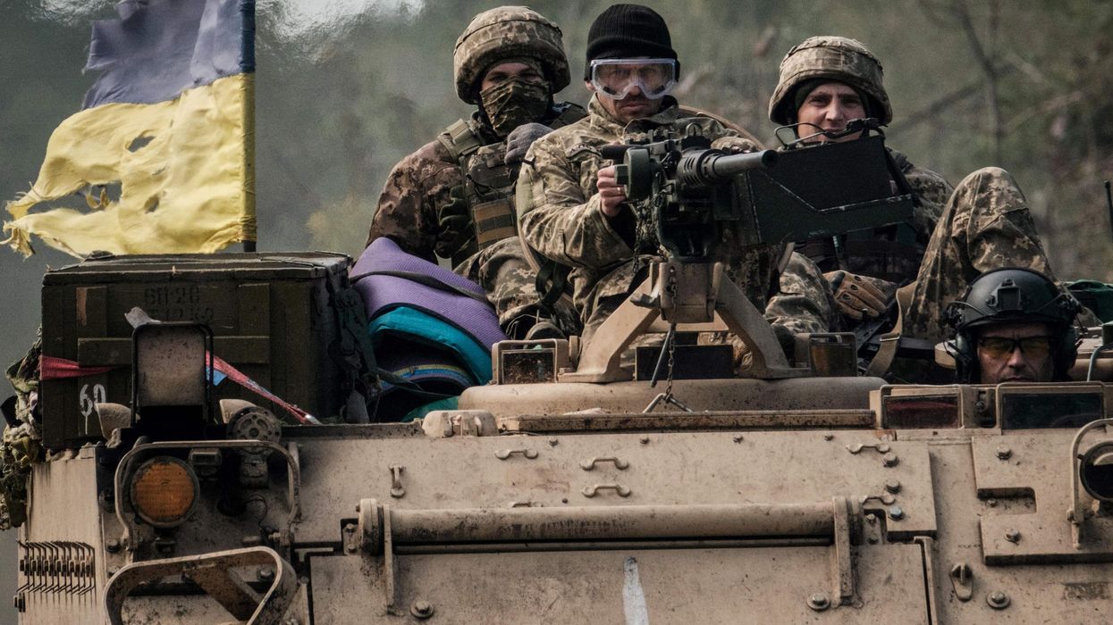 Ukraine soldiers sitting on a tank