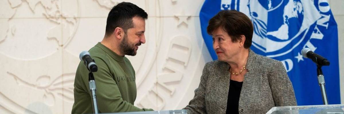 Ukrainian President Volodymyr Zelensky shakes hands with International Monetary Fund (IMF) Director Kristalina Georgieva