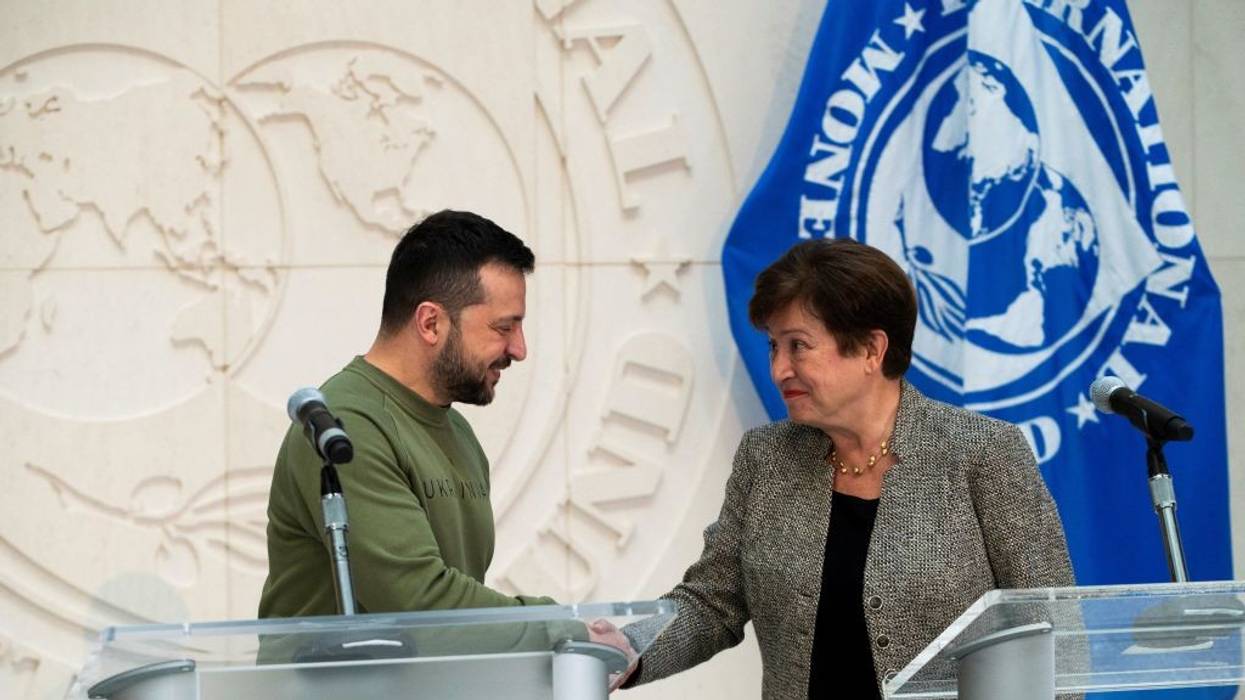 Ukrainian President Volodymyr Zelensky shakes hands with International Monetary Fund (IMF) Director Kristalina Georgieva