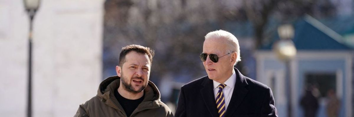 Ukrainian President Volodymyr Zelensky walks next to President Joe Biden  after he arrived for a visit in Kyiv, Ukraine on February 20, 2023.