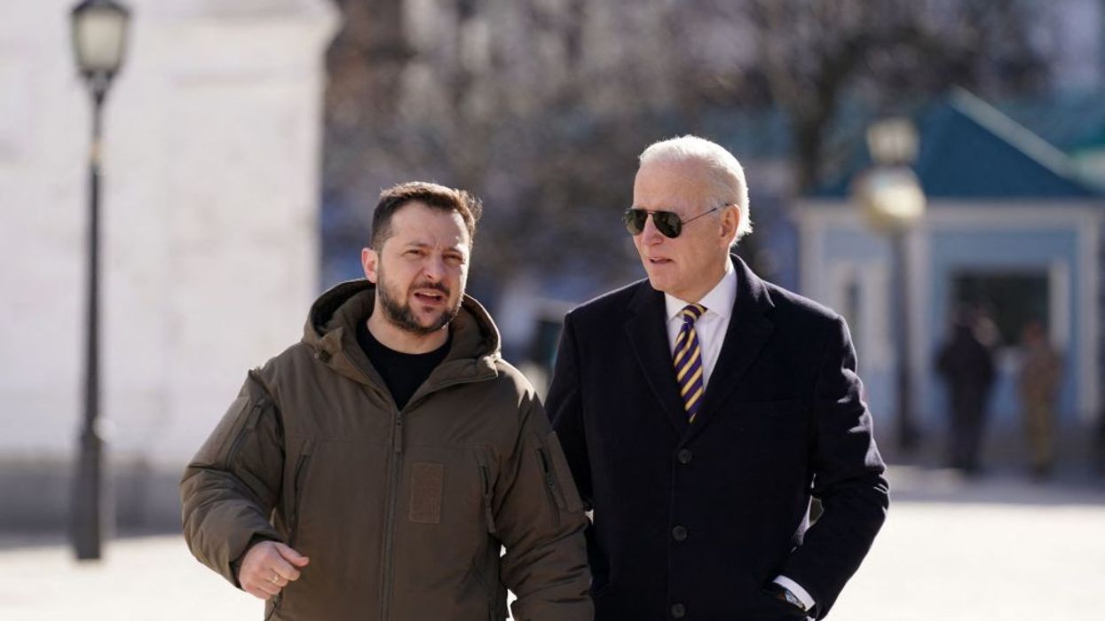 Ukrainian President Volodymyr Zelensky walks next to President Joe Biden after he arrived for a visit in Kyiv, Ukraine on February 20, 2023.